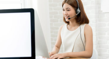 Beautiful asian businesswoman woking in telemarketing business company as call center agent to support customer for good communication service