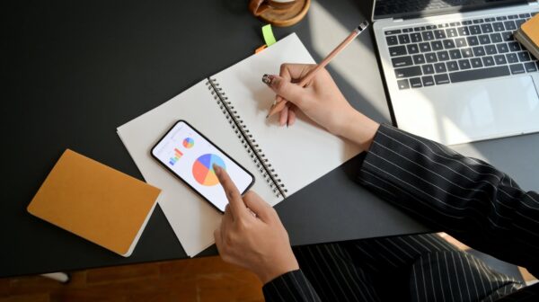 person writing on white paper